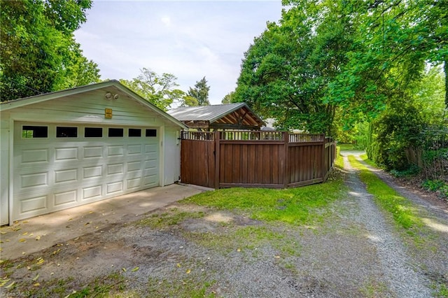 detached garage with fence