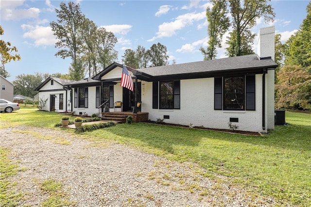 ranch-style home with a front lawn and central AC unit