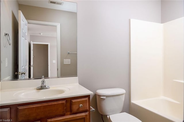 bathroom featuring visible vents, vanity, and toilet