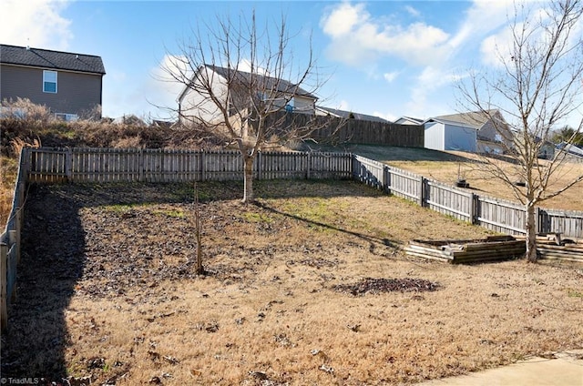 view of yard with a fenced backyard