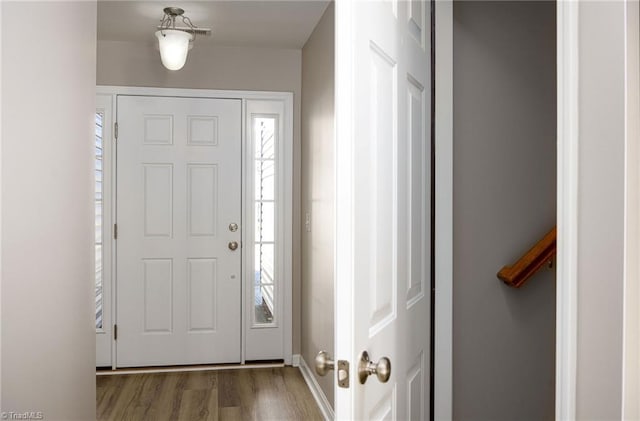 foyer entrance with wood finished floors