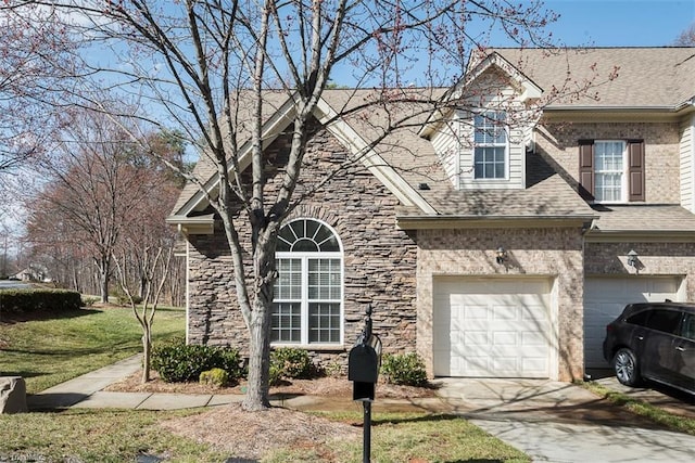 view of front of house with brick siding, a shingled roof, concrete driveway, a garage, and stone siding