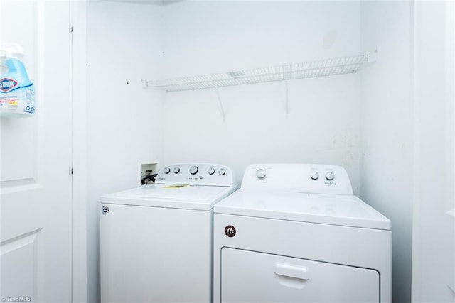 washroom featuring washer and dryer