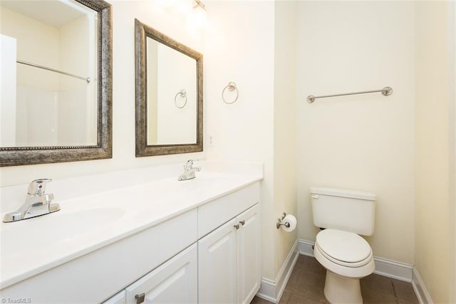 full bath with toilet, tile patterned flooring, double vanity, and a sink