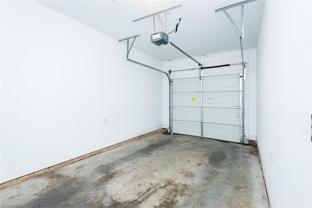 garage featuring baseboards and a garage door opener