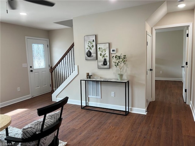 foyer featuring visible vents, baseboards, dark wood finished floors, stairs, and recessed lighting