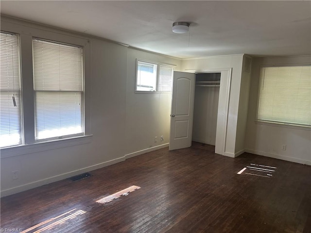 1712 E First St, Winston-Salem, NC 27101 - unfurnished bedroom with wood finished floors, a closet, and ornamental molding