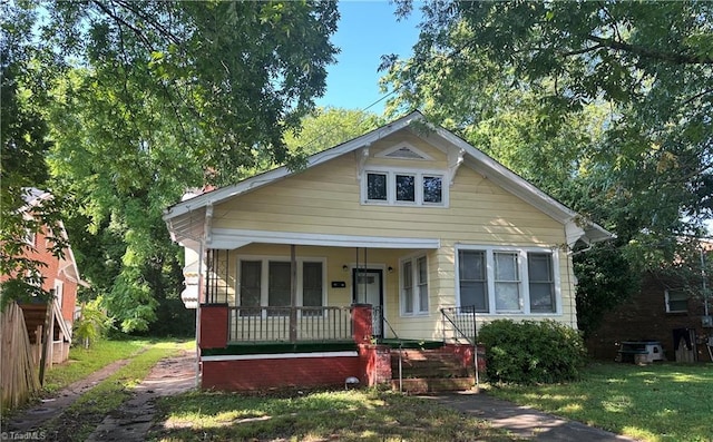1712 E First St, Winston-Salem, NC 27101 - bungalow-style home with a porch and a front lawn