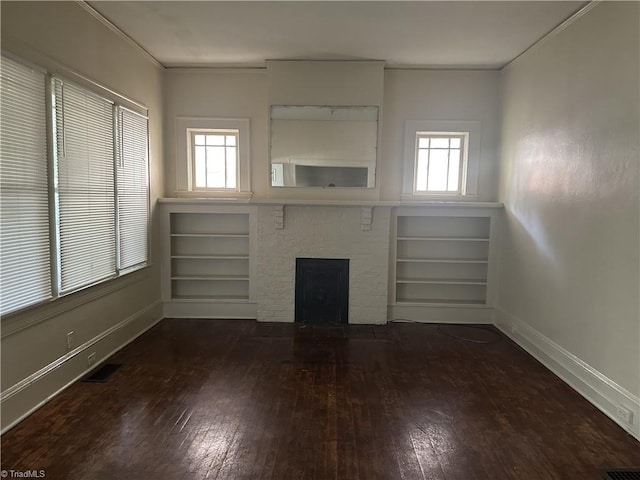 1712 E First St, Winston-Salem, NC 27101 - unfurnished living room with hardwood / wood-style flooring, crown molding, plenty of natural light, and a fireplace with flush hearth