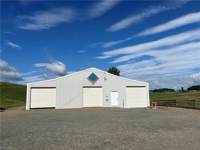 garage featuring a rural view