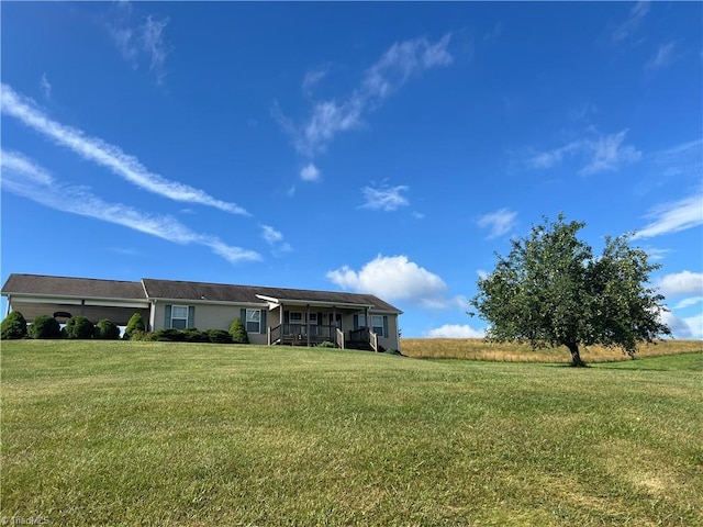 ranch-style home with a front lawn