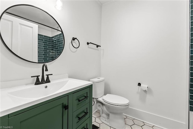 bathroom with toilet, vanity, and walk in shower