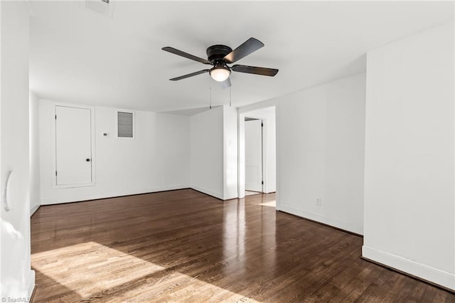 spare room featuring ceiling fan and dark hardwood / wood-style flooring