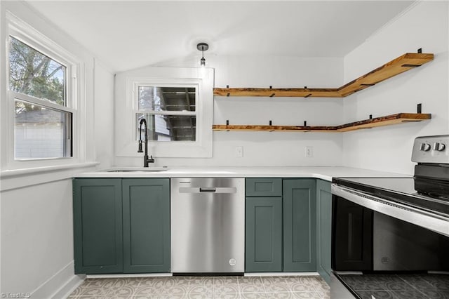 kitchen featuring green cabinets, appliances with stainless steel finishes, hanging light fixtures, and sink