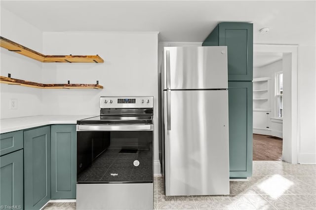 kitchen featuring green cabinets and stainless steel appliances