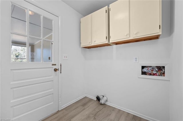 clothes washing area with washer hookup, cabinet space, light wood finished floors, baseboards, and hookup for an electric dryer