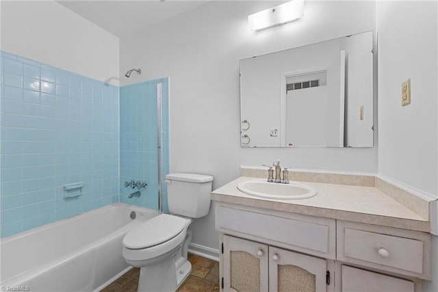 bathroom with vanity, shower / tub combination, toilet, and baseboards