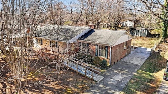 single story home with brick siding and a chimney