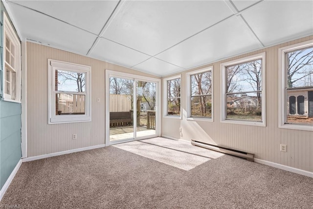 unfurnished sunroom with lofted ceiling and a baseboard radiator