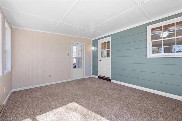 carpeted spare room with baseboards