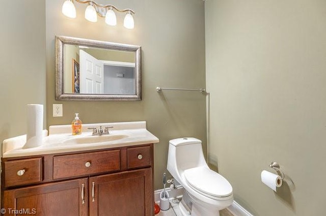 bathroom featuring toilet and vanity