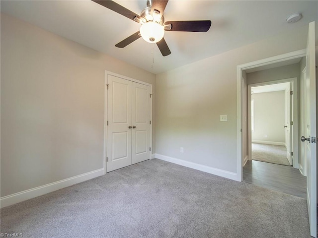 empty room with light hardwood / wood-style flooring and ceiling fan