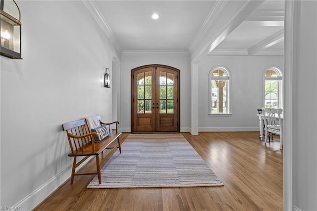 7604 Pemberley Dr, Oak Ridge, NC 27310 - foyer with french doors, plenty of natural light, wood finished floors, arched walkways, and crown molding