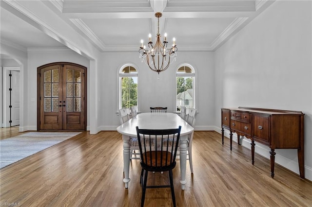 7604 Pemberley Dr, Oak Ridge, NC 27310 - dining space with a chandelier, arched walkways, light wood-type flooring, crown molding, and french doors