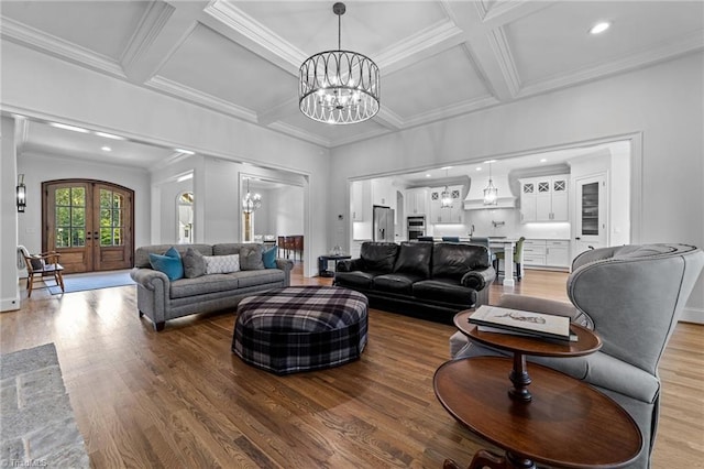 7604 Pemberley Dr, Oak Ridge, NC 27310 - living area with a chandelier, light wood-type flooring, coffered ceiling, french doors, and beam ceiling