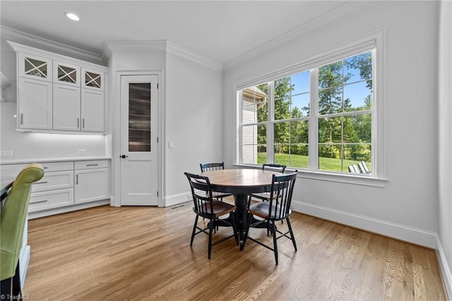 7604 Pemberley Dr, Oak Ridge, NC 27310 - dining room featuring plenty of natural light, light wood-style flooring, and crown molding
