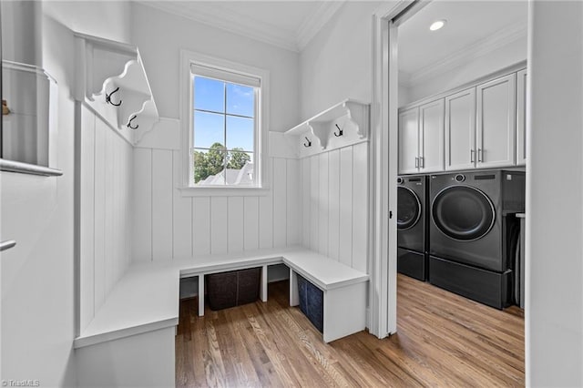 7604 Pemberley Dr, Oak Ridge, NC 27310 - mudroom with washing machine and dryer, wainscoting, light wood-style flooring, and crown molding
