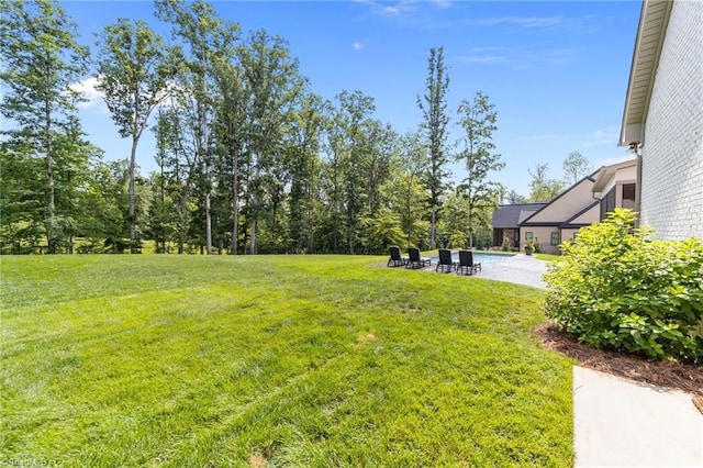 7604 Pemberley Dr, Oak Ridge, NC 27310 - view of grassy yard with a patio