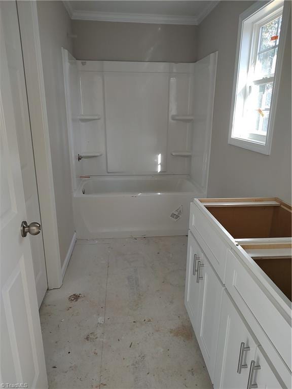 bathroom with tub / shower combination and crown molding