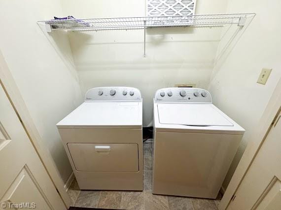 clothes washing area featuring laundry area and independent washer and dryer