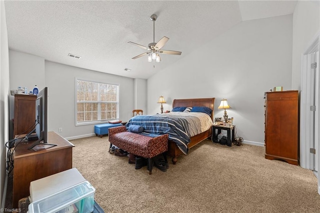 bedroom featuring lofted ceiling, a textured ceiling, carpet, baseboards, and ceiling fan