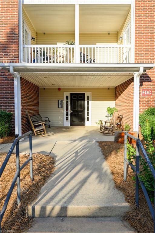 back of property with a patio area and a balcony