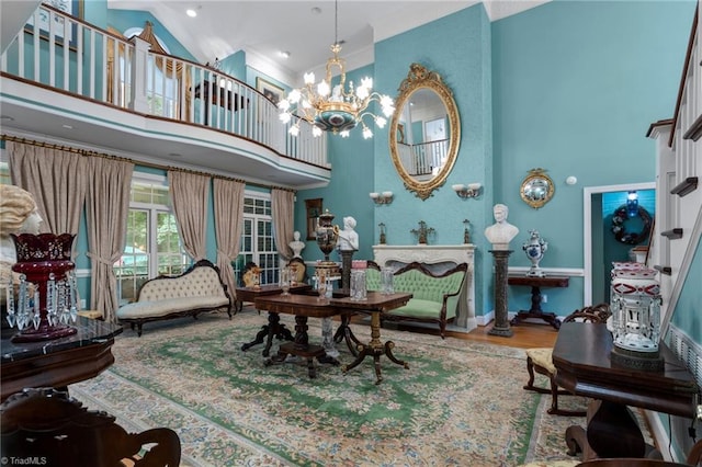 dining room featuring hardwood / wood-style flooring, a chandelier, and high vaulted ceiling