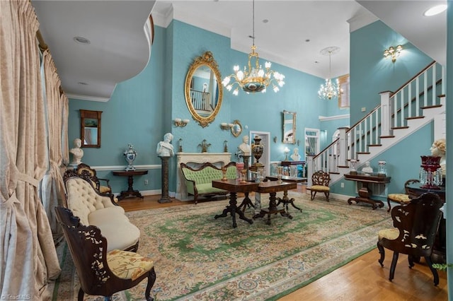 dining area featuring ornamental molding, hardwood / wood-style floors, and a notable chandelier