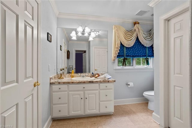 bathroom featuring ornamental molding, vanity, and toilet