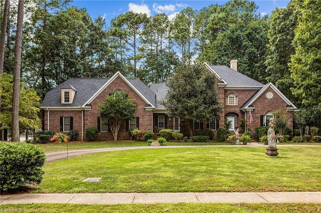 view of property featuring a front lawn