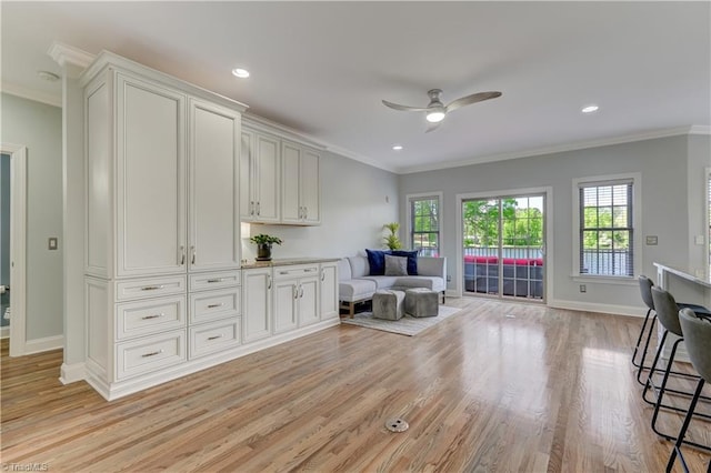 sitting room with crown molding, light wood-style floors, ceiling fan, recessed lighting, and baseboards