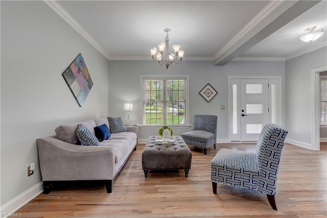 living room featuring baseboards, an inviting chandelier, and wood finished floors