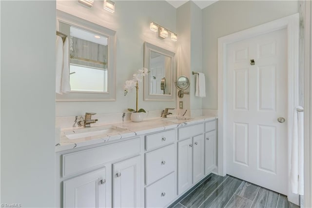 bathroom featuring double vanity and a sink