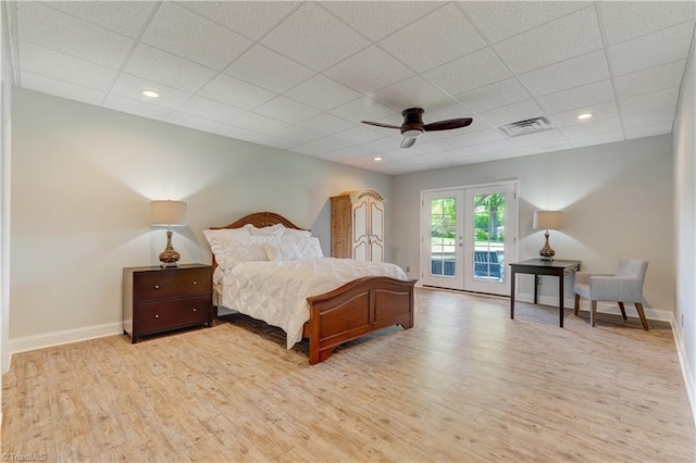 bedroom featuring visible vents, baseboards, access to exterior, french doors, and light wood-style flooring