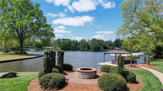 exterior space with an outdoor fire pit and a gazebo
