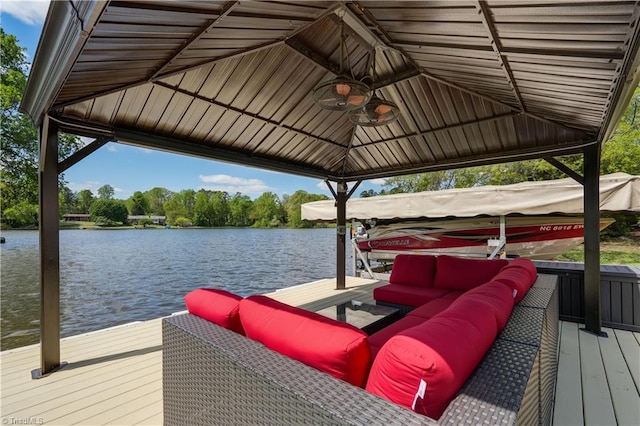 dock area with a water view and boat lift