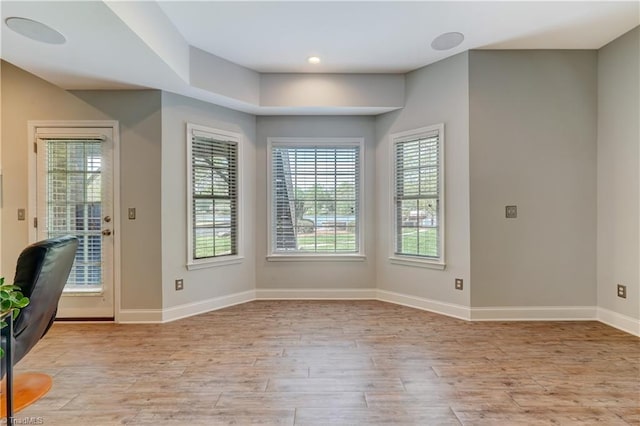 interior space with recessed lighting, light wood-style floors, and baseboards