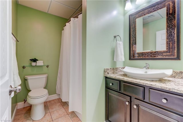 full bathroom featuring toilet, vanity, tile patterned flooring, and visible vents