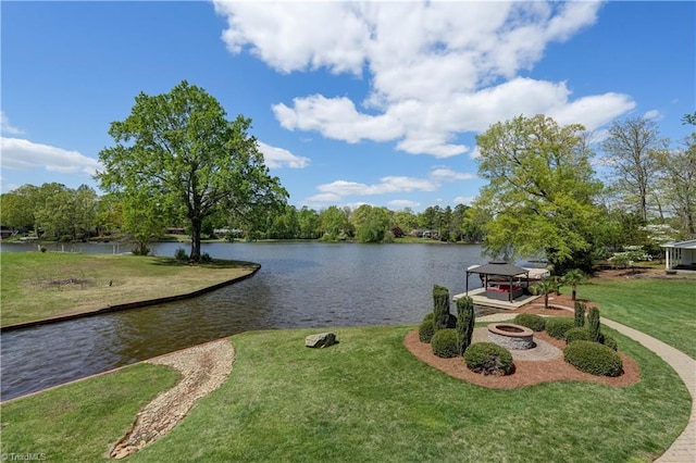 view of water feature with a gazebo and a fire pit