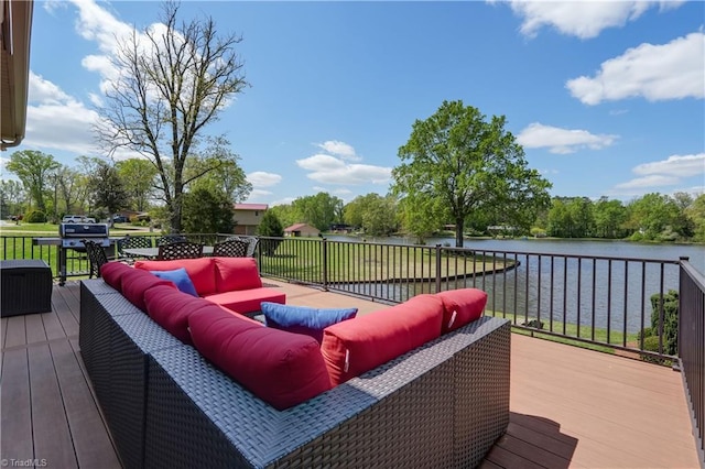 wooden deck featuring outdoor lounge area and a water view
